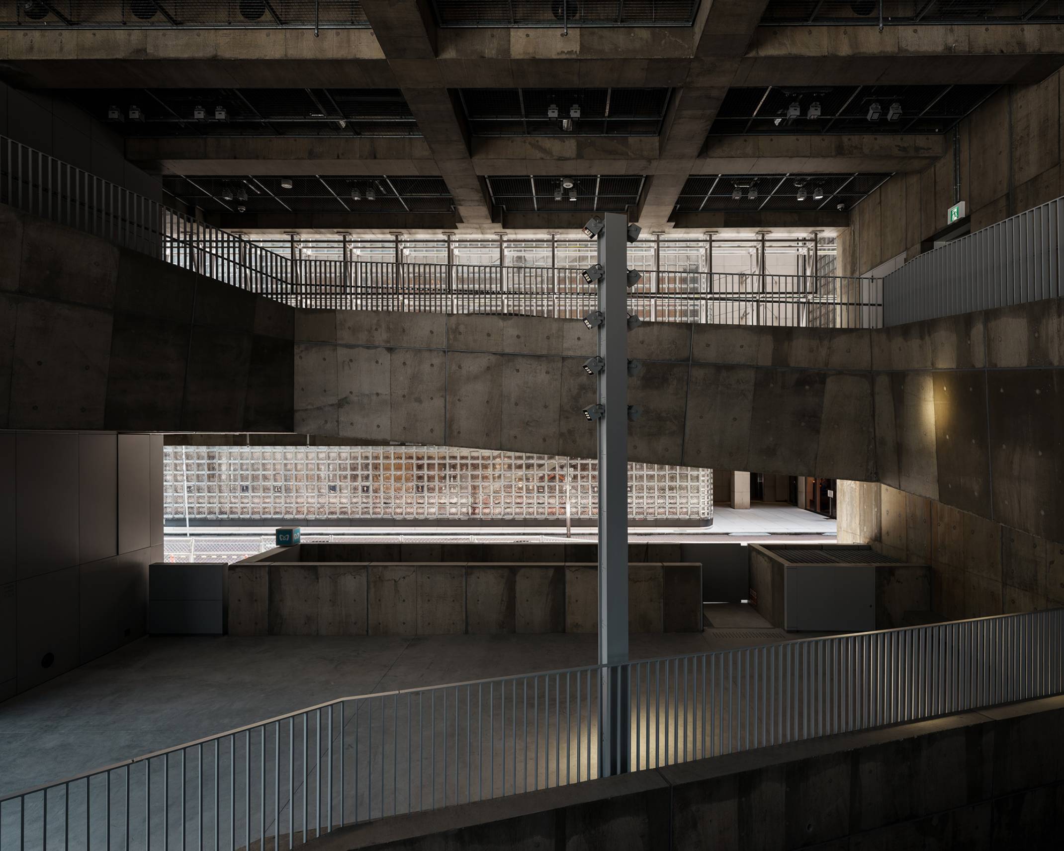 Exterior. The atrium in the first and second above-ground floors allows glimpses of Sony Street through the building.