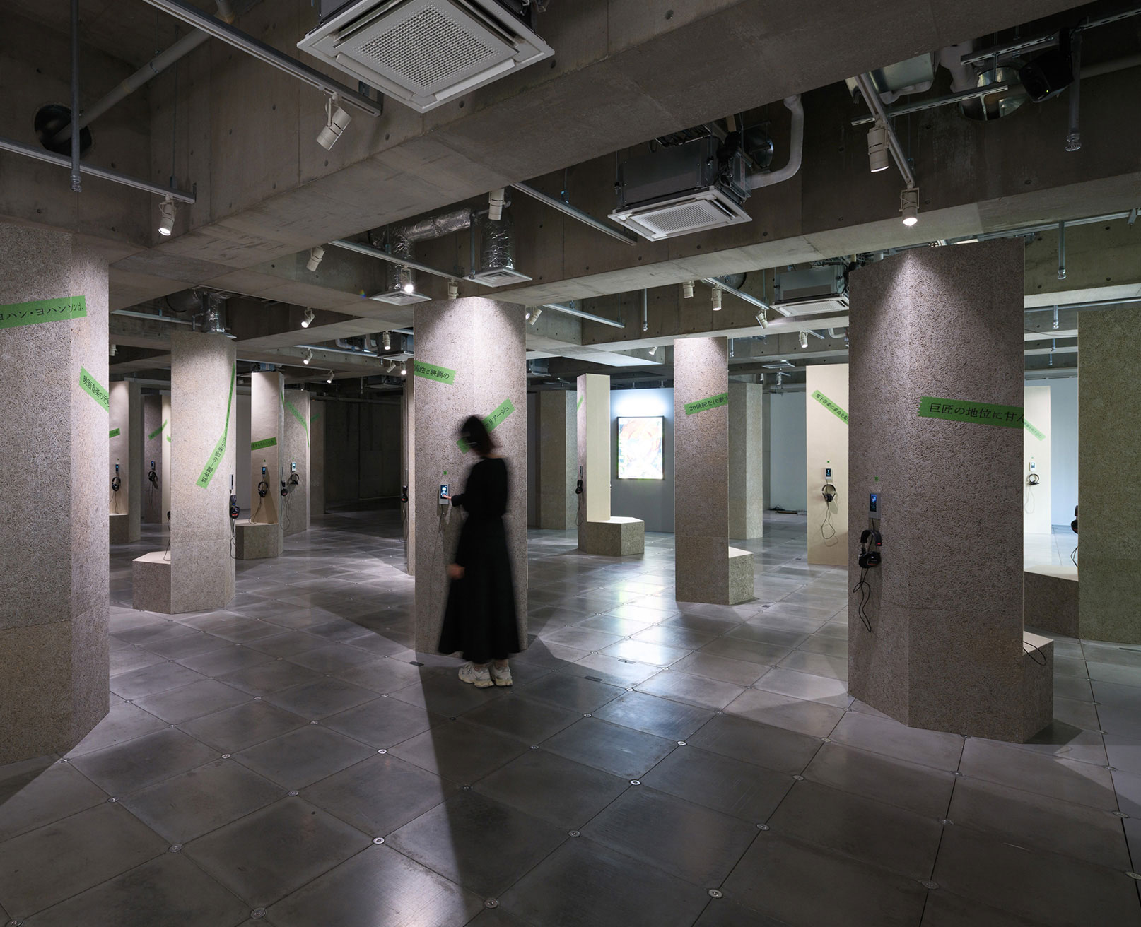 Exhibit. Each pillar is equipped with headphones and a display, allowing visitors to listen to music.