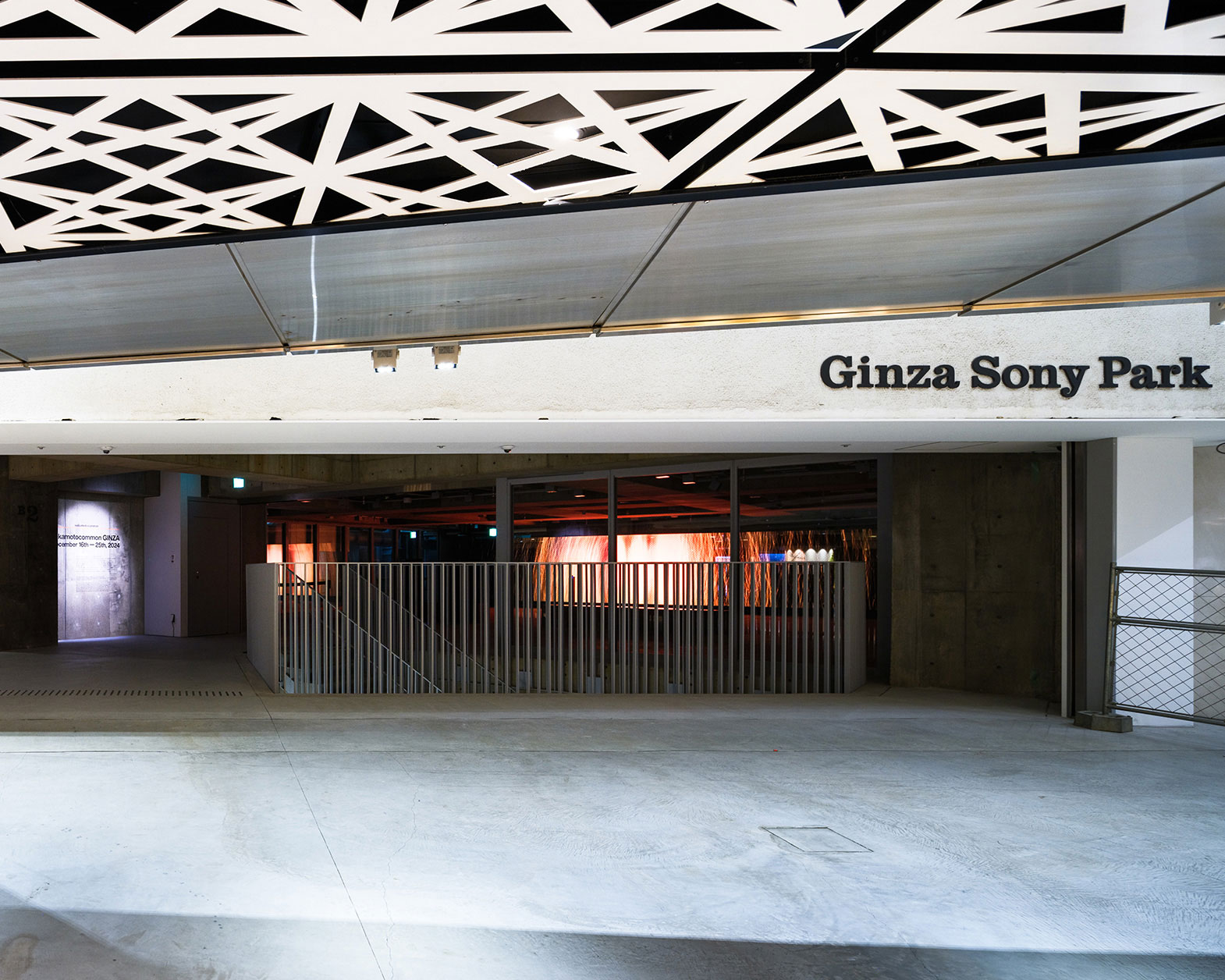 At the back of the floor, red and orange visuals can be seen.