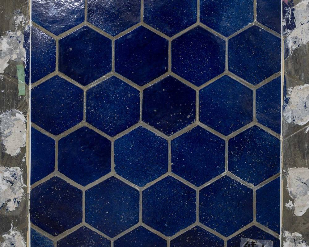 Interior. The demolition process revealed the walls of the Sony Building when the company was first founded, with its hexagonal/honeycomb-shaped blue tiles.