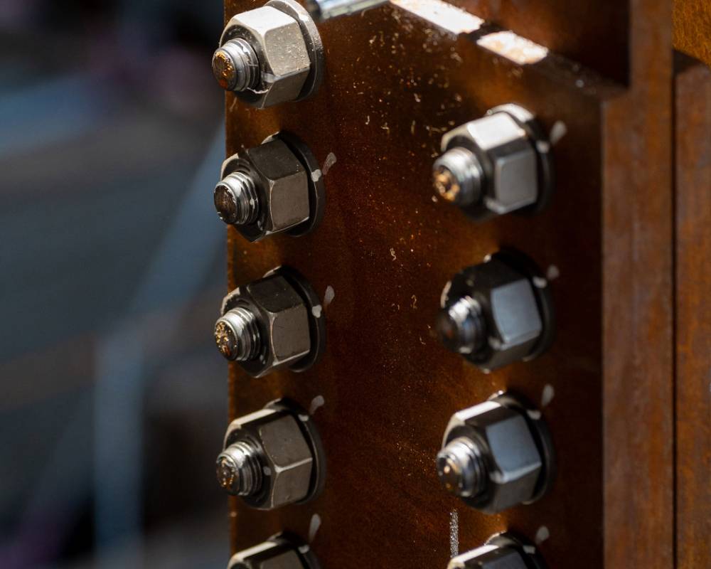 Close-up. Numerous bolts are used to assemble the steel frame.