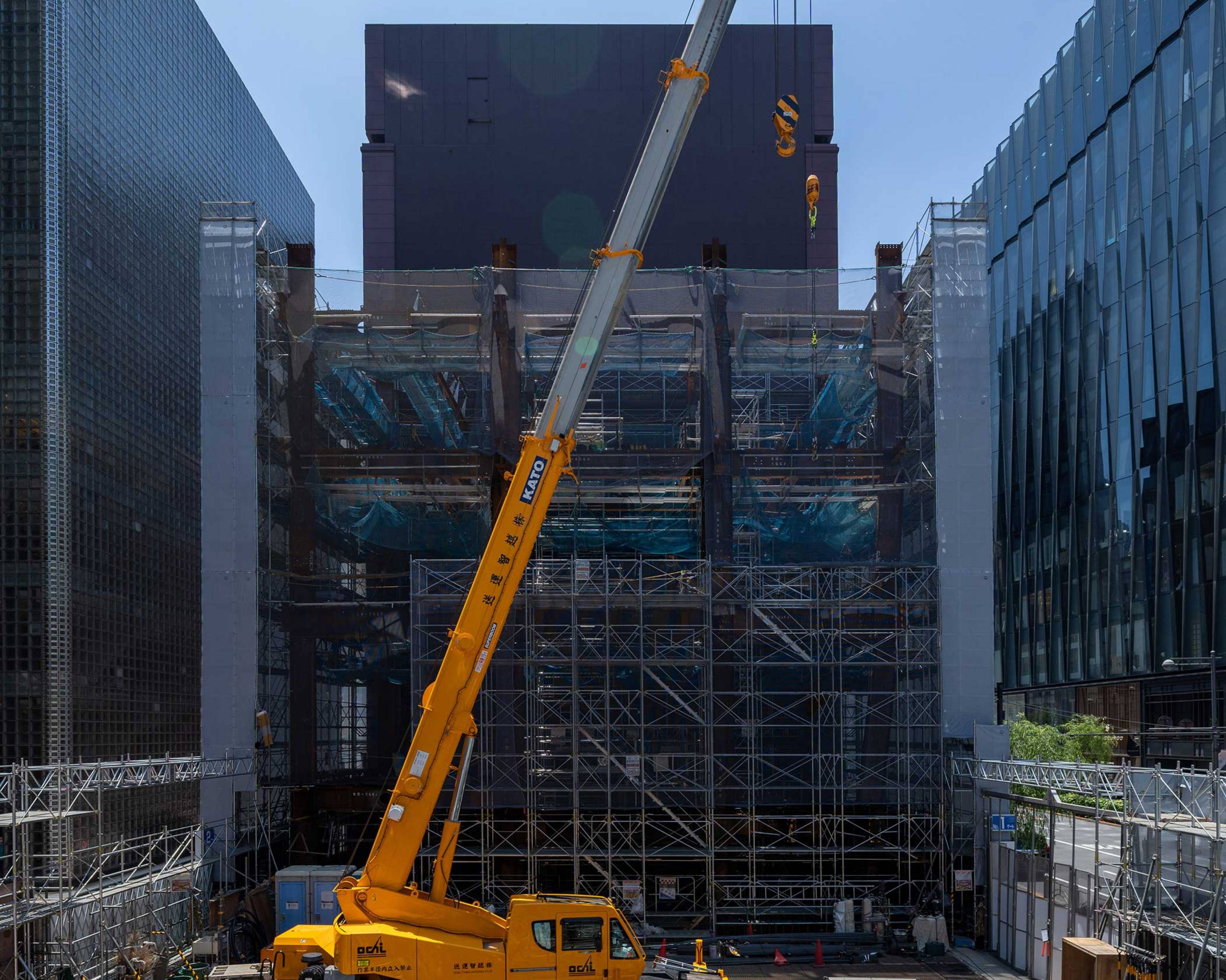 Exterior. Construction crane on the ground. The steel frame on the Tokio Marine Nichido Building side has been built up to the third floor.