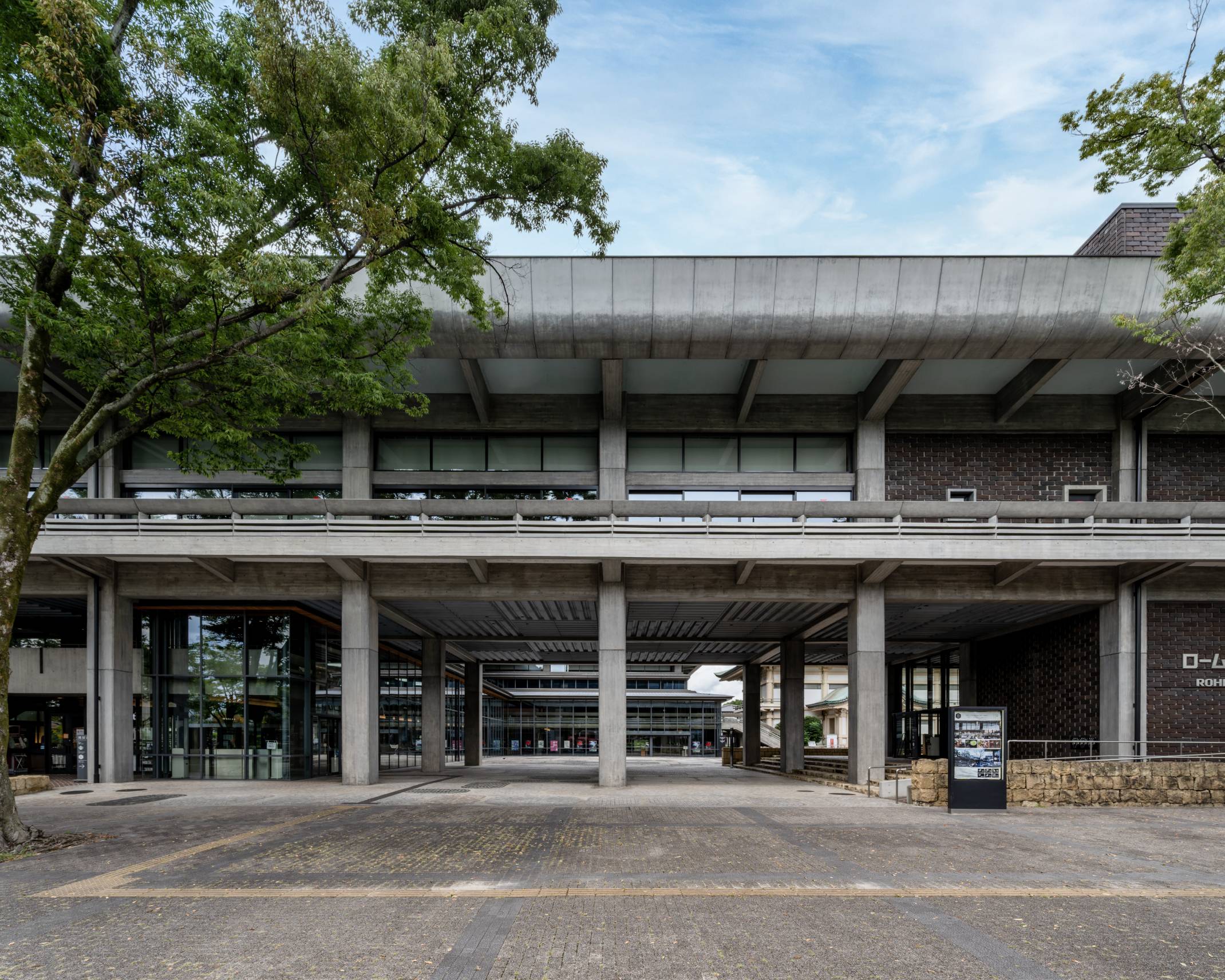 Exterior. Duck under the façade of the wide, low building, and you find yourself at the glass entrance to the venue.