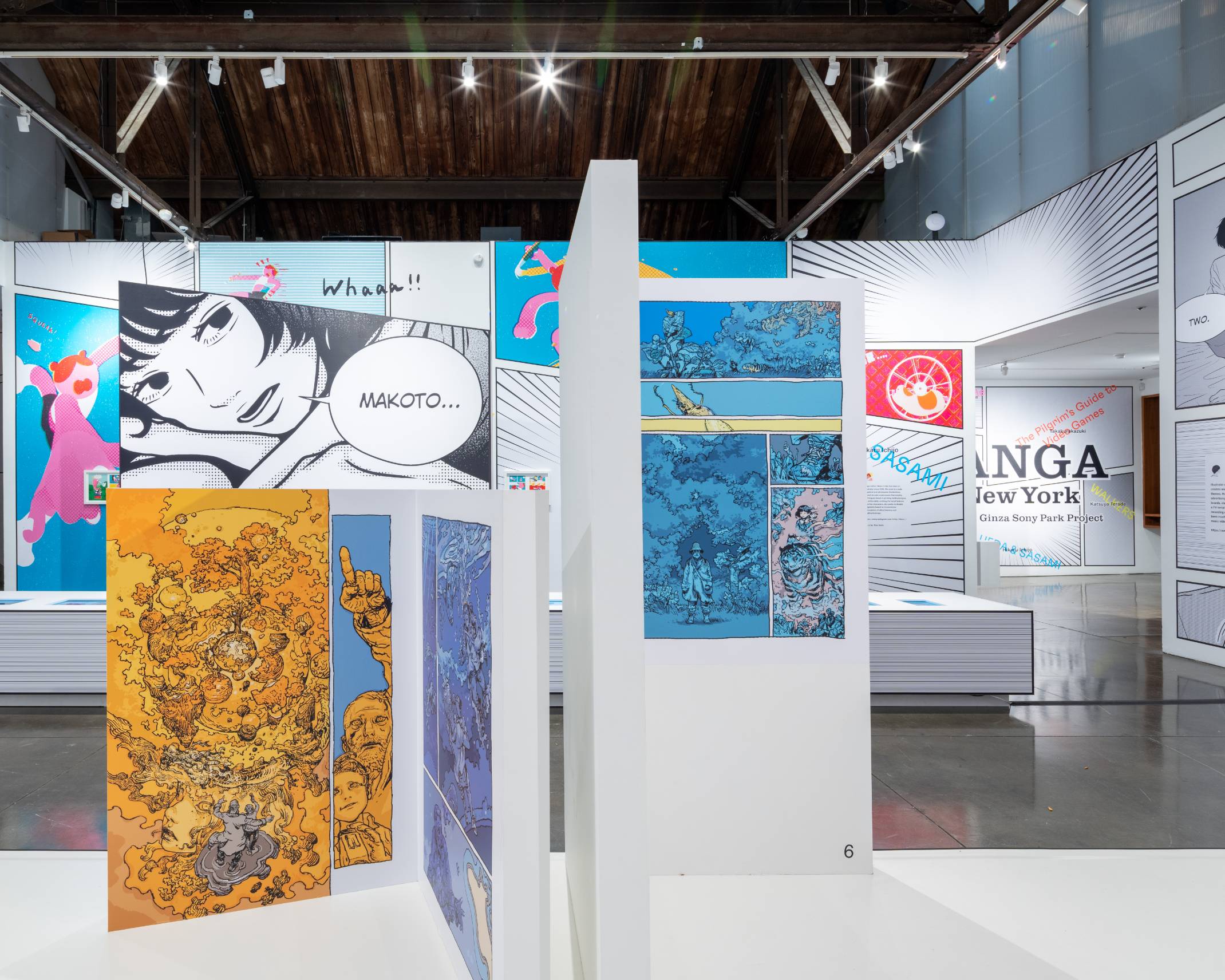 Interior. The entire venue has been designed to look like a manga, with the use of paneling, line effects, speech bubbles, and other manga elements.