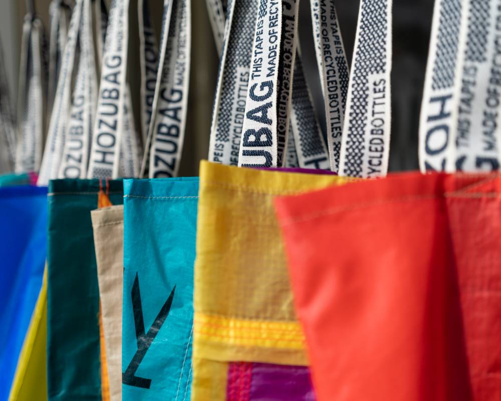 Exhibit. Bags of various colors and patterns hung up.